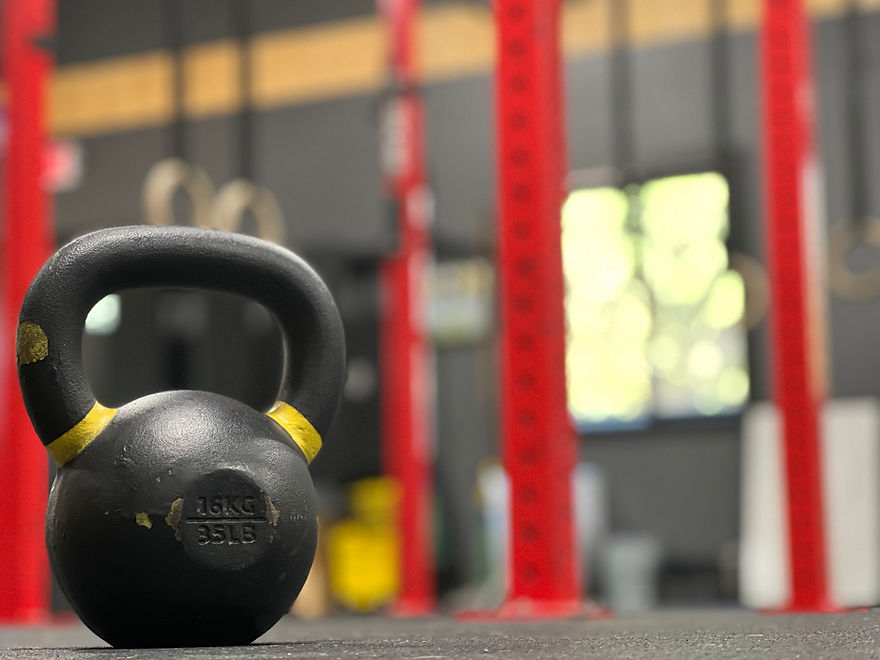 Kettlebell on the floor with fitness center background
