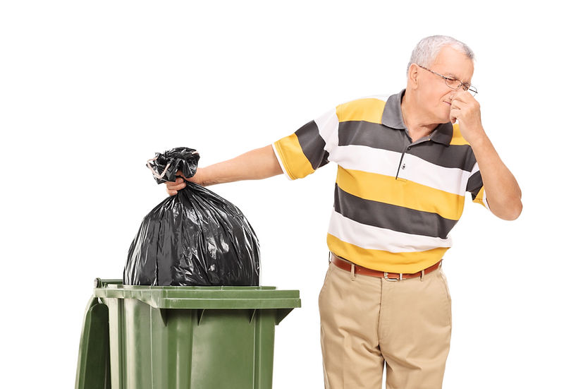 Man holding trash bag and nose at smelling trash can.jpg