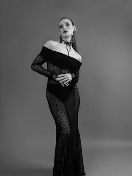 Full body shot of female model in black lace dress