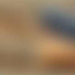 A before and after picture of a real photograph of rock layers in nature that inspired a fiber art sculpture of the same rock layers as an art piece in blues, browns, neutrals, and golds.