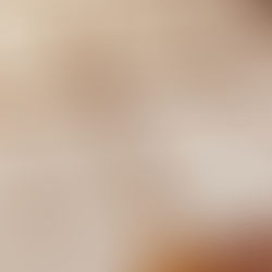 Rows of handmade fabric labels reading “Elemental Living – Deep Earth: Lithic Blue” arranged on a table, prepared for attachment to fiber art pieces.