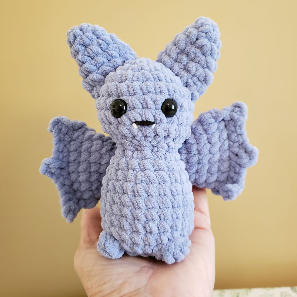 Bitty Bat - Little purple crochet bat with big wings and white fangs.