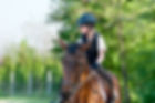 young girl riding a horse.jpg