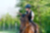 young girl riding a horse.jpg
