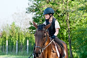 young girl riding a horse.jpg