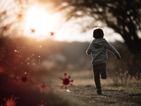 Child running through a sunny field symbolizing recovery after antibody-based stem cell transplant.