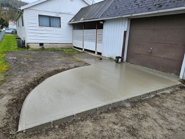 Concrete driveway and patio poured by Scot Stone Co. LLC in Myrtle Creek, Oregon — residential concrete work with clean, smooth finishes.