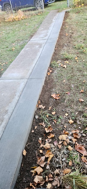 Mini driveway for motorcycle parking.