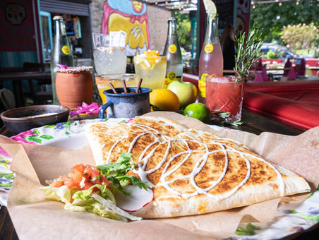 Cheesy quesadilla and mexican drinks at Broken English Chicago