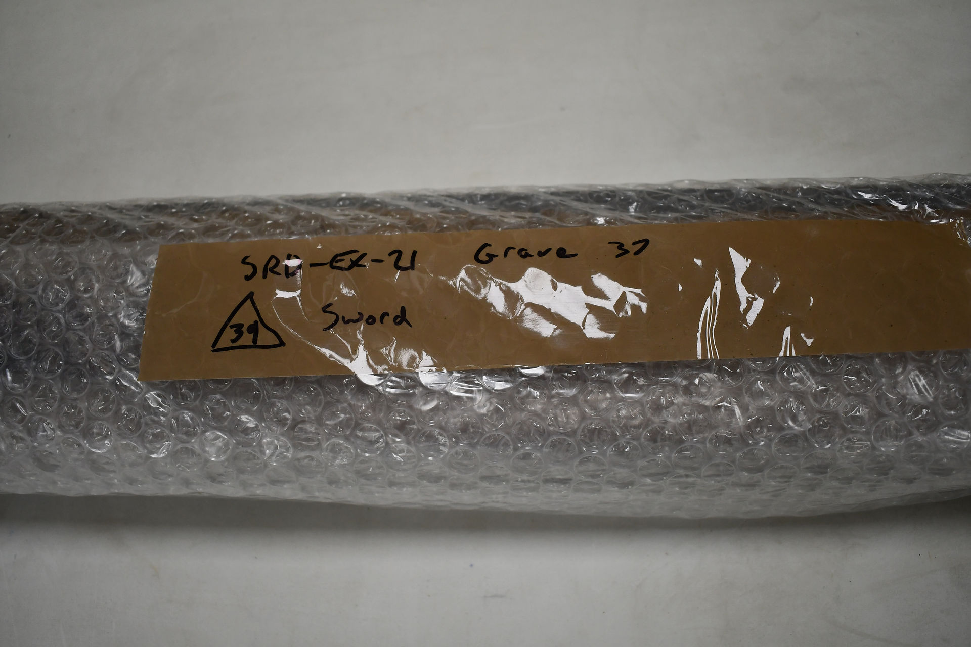 Photo of sword in bubblewrap