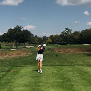 Sunlit fairway shot of Amanda Alcamo taking a focused swing in the club championship final.