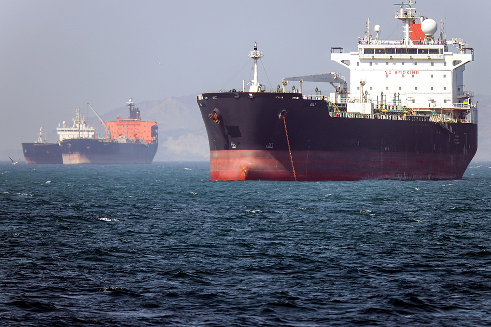 Tankers in Gulf waters during the 2026 conflict. Visible Hormuz crossings remain a fraction of the pre-war baseline. Photo via NPR.org; used for commentary.