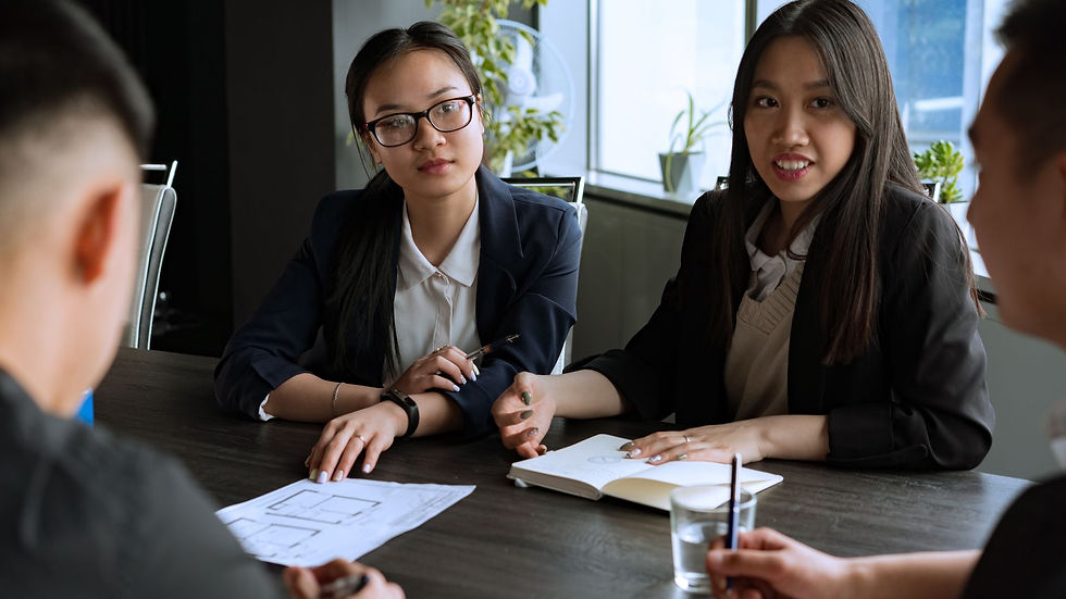 Business colleagues comparing supplier proposals during a meeting