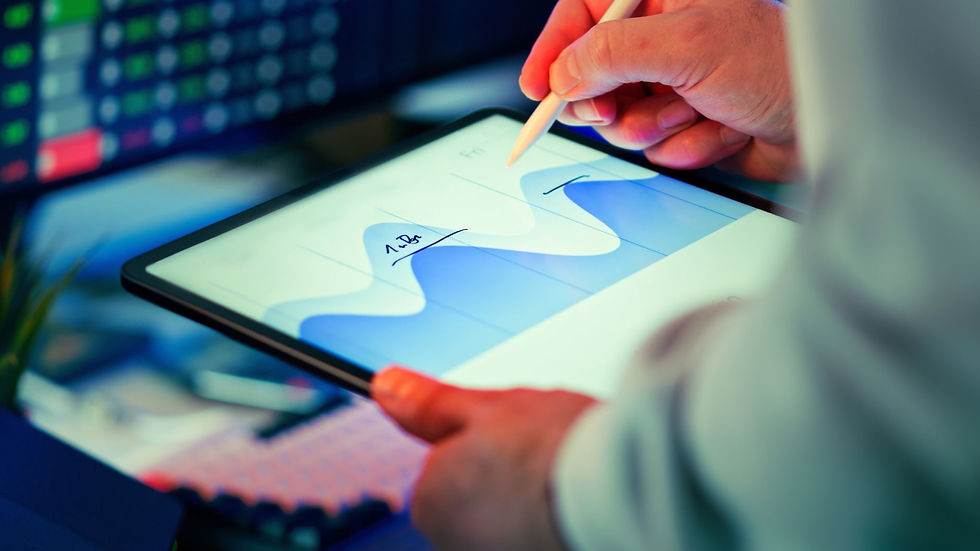A marketing and analytics team reviewing performance data on large screens in an office