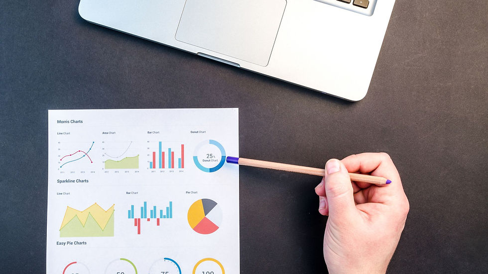 Researchers reviewing business segmentation charts and interview notes in a workshop