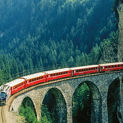 Luxury scenic train journey through the Swiss Alps with breathtaking mountain views