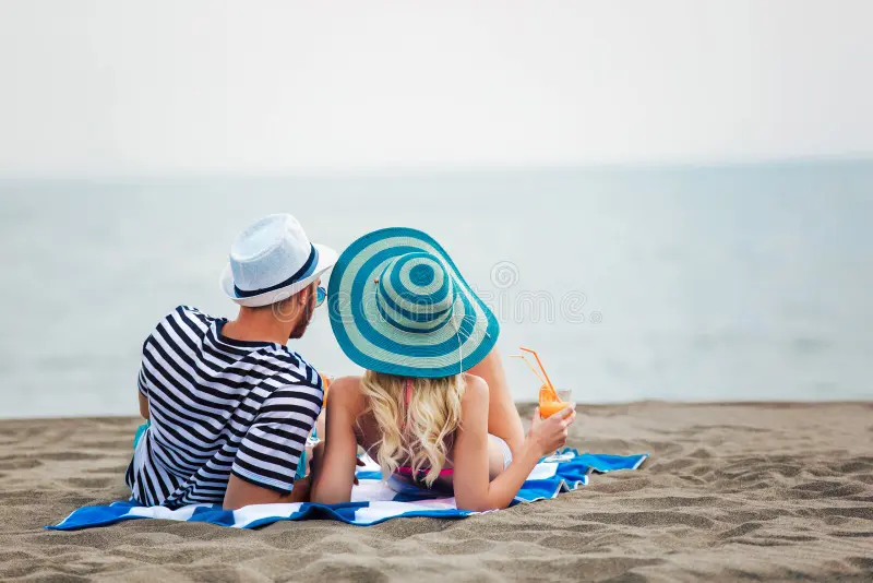 Romantic beachfront dining with premium cocktails at a luxury all-inclusive resort