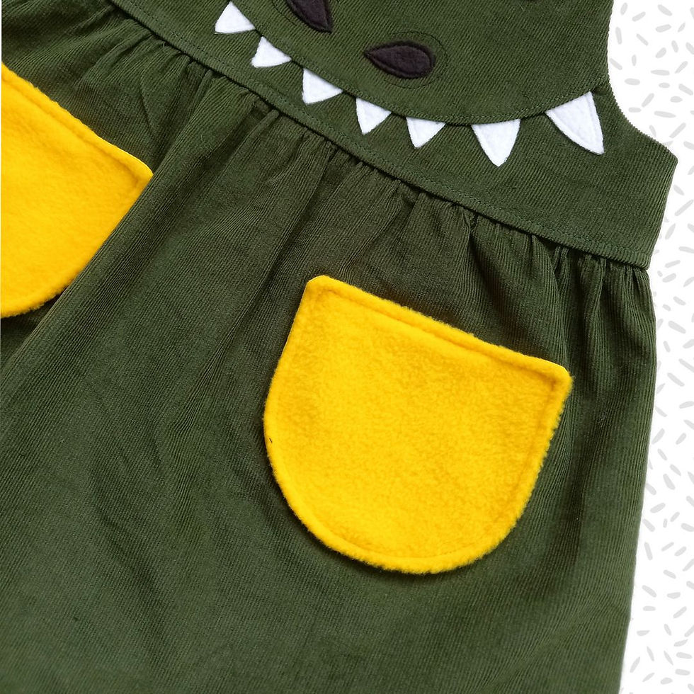 Thumbnail: Girl's handmade dinosaur pinafore dress for ages 0-6 years.