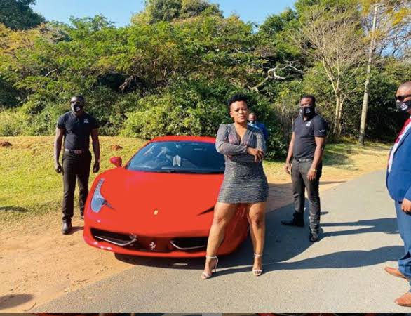 Zodwa wabantu standing by her supercar