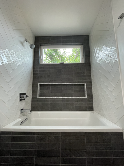 garage tile stone veneer home construction renovation contractor tile contractor lighting design designer remodel general contractor kitchen backsplash sink slab refrigerator fridge ikea cabinets floating shelves bathroom tub niche toilet bathroom vanity lighting