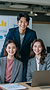 u6826433952_Three_young_East_Asian_office_workers_sitting_at__0389d024-3a78-4a86-ab3f-4e2e
