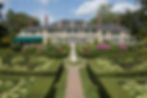 large estate with beautiful gardens and walkway