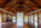 large banquet hall with wooden beams on the ceiling