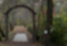 decorative arbor at the entrance to a trail