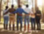 a line of people with arms wrapped around each other, creating community