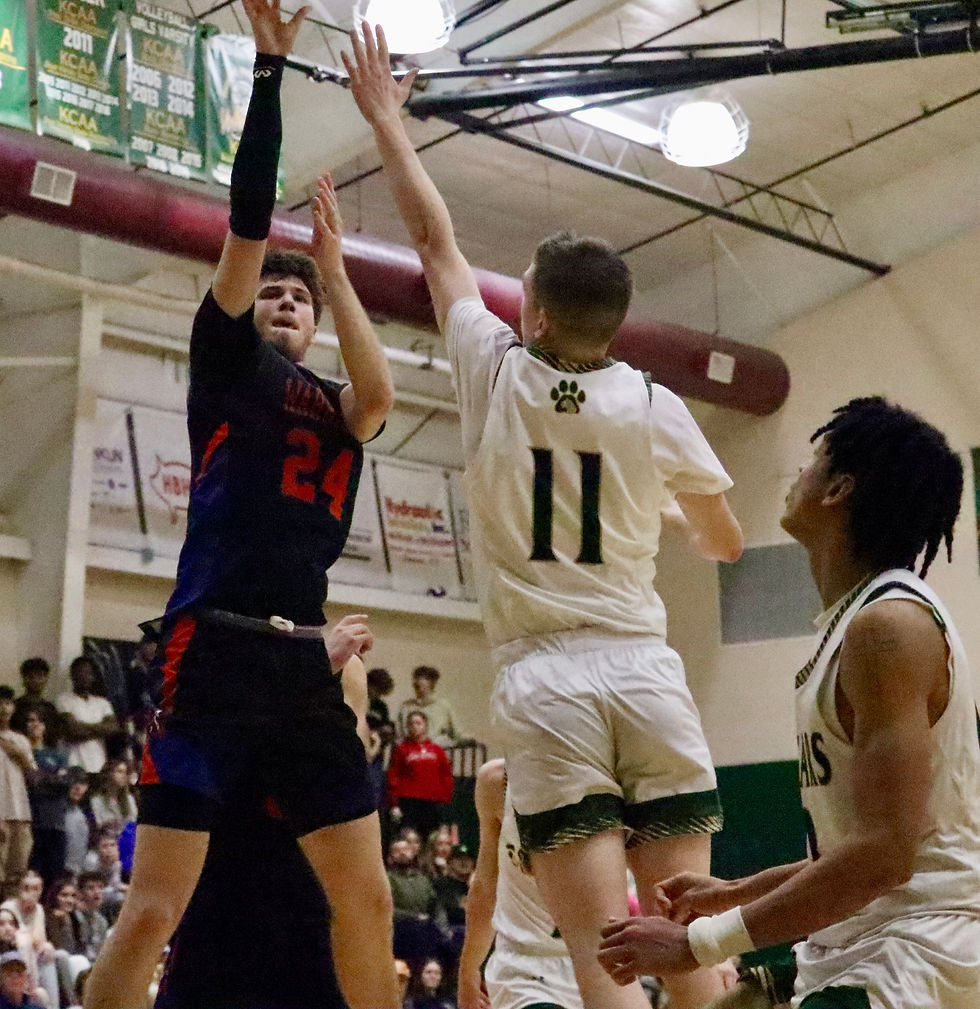 Photo by Jacob Pratt: Southwestern junior Jarrett Simpson (24) shoots a floater from the paint past the defense from Somerset Christian senior Gavin Lewis (11) during the game between the Warriors and the Cougars on Friday.