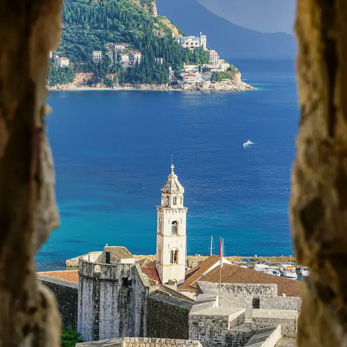 Unique perspective view of Dubrovnik Old Town walls included in our premium private car service itinerary.