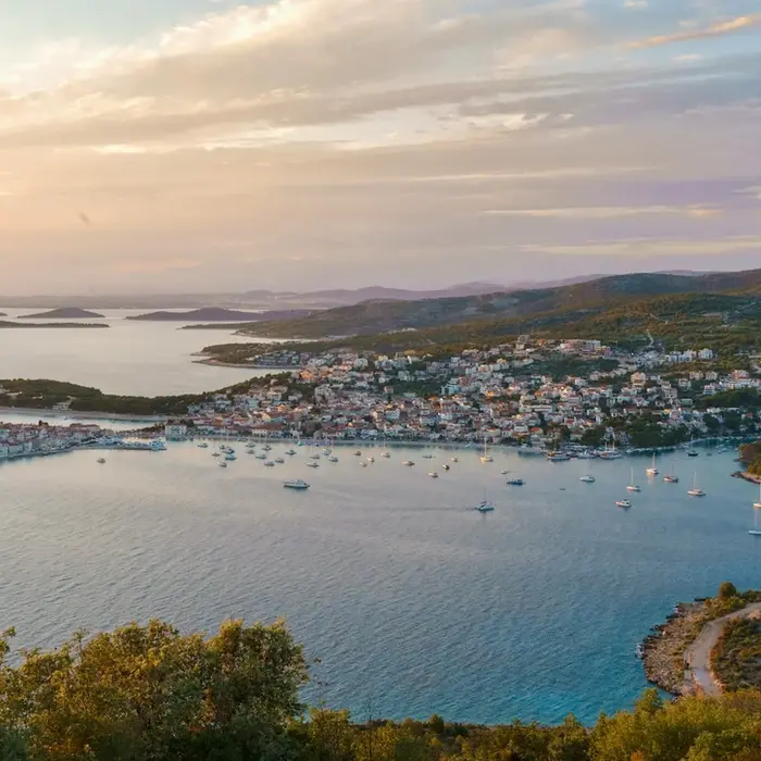 Panoramic view of Primosten old town during a flexible private transfer from Split to Krka.