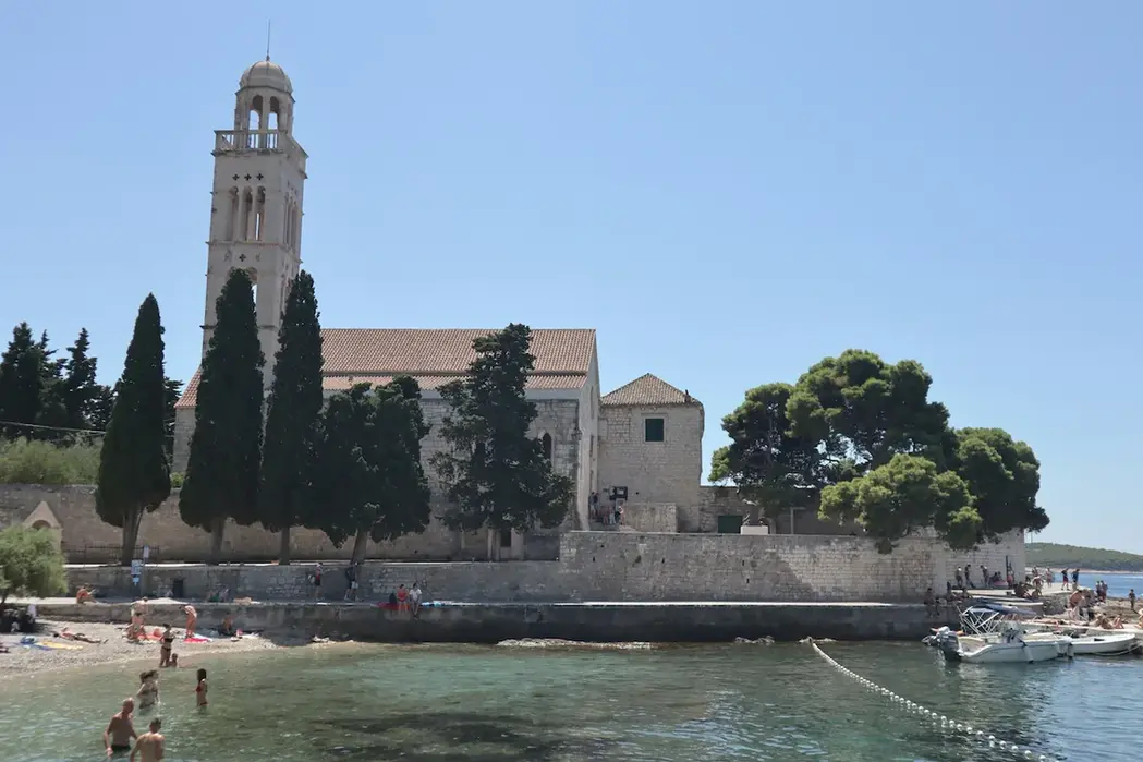 A beautiful historic church near the sea visited on a flexible layout with a premium Hvar chauffeur service.
