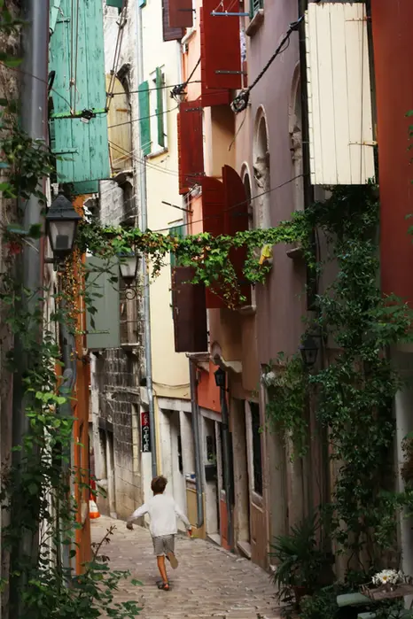 Walking through the charming narrow streets of Rovinj old town with a dedicated private driver on Istria.