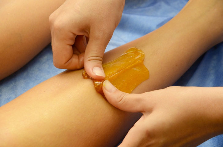 Sugaring wax on the leg for hair removal