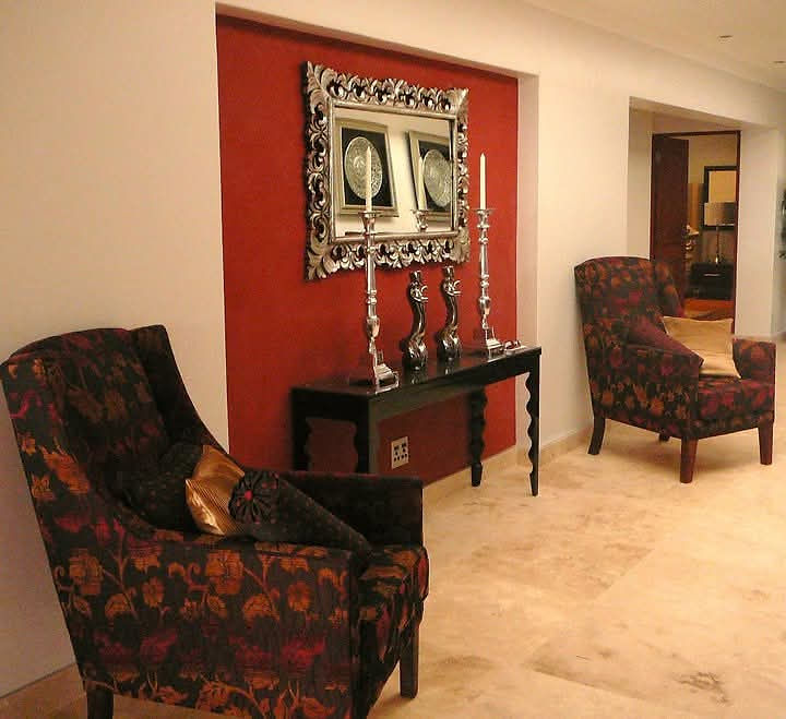 Stylish interior space featuring accent wall and armchairs