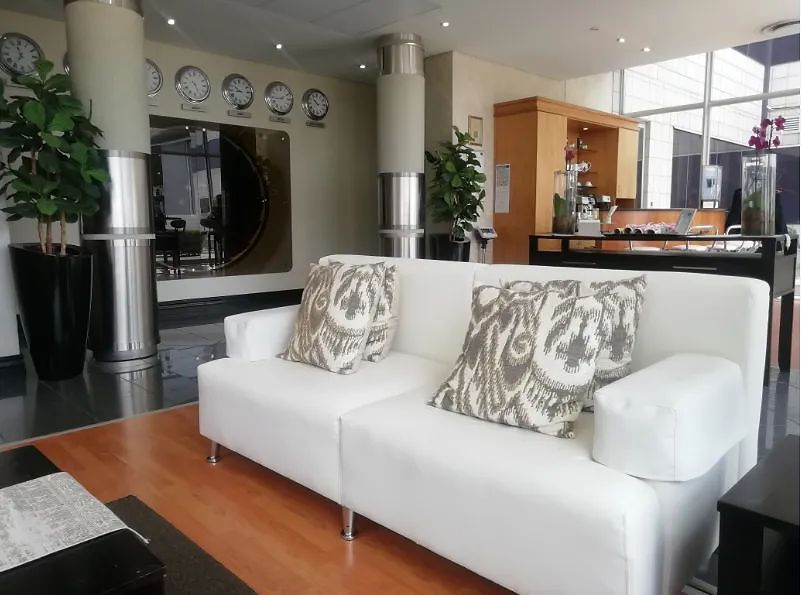 Stylish lobby space with white sofa and plants