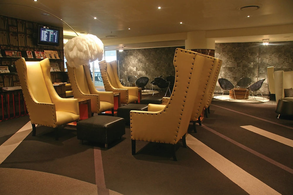 Stylish lounge space with yellow armchairs