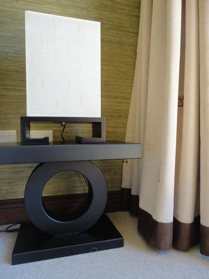 Modern table lamp with geometric base in a contemporary space.