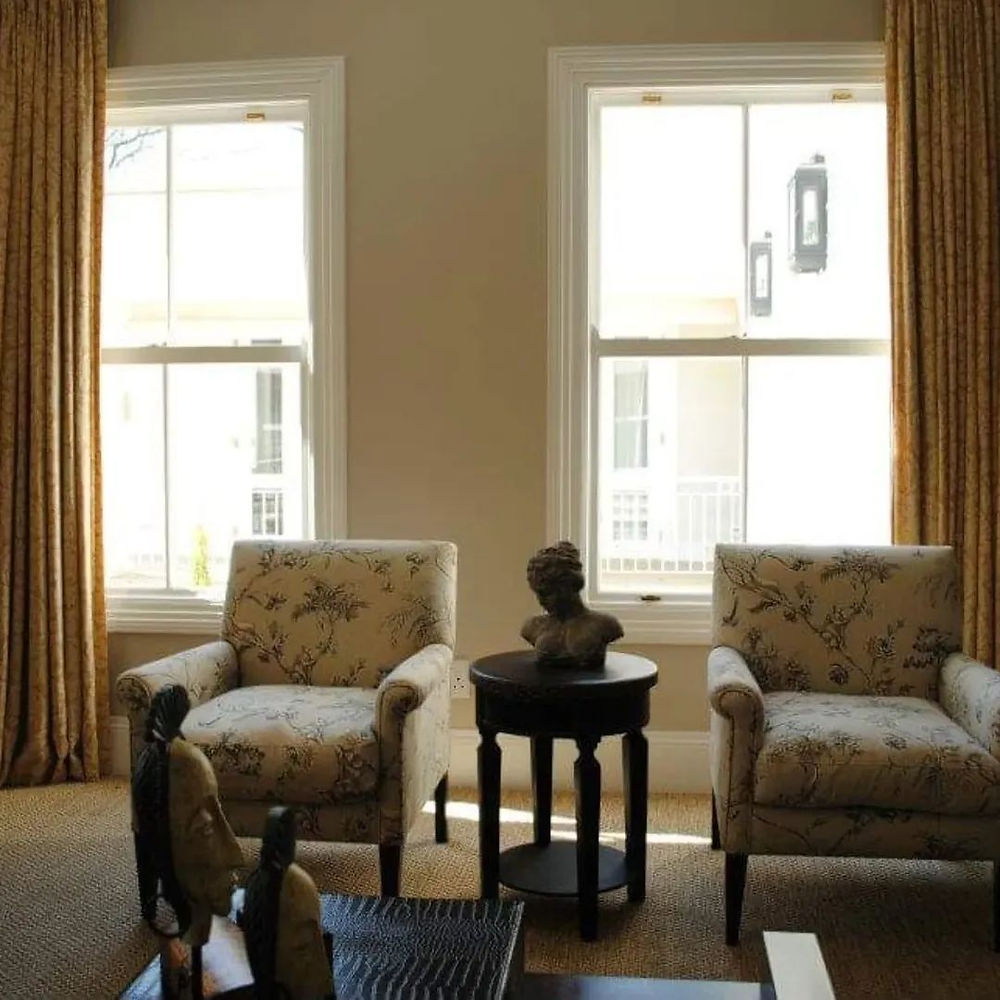 Cozy living space with armchairs and windows