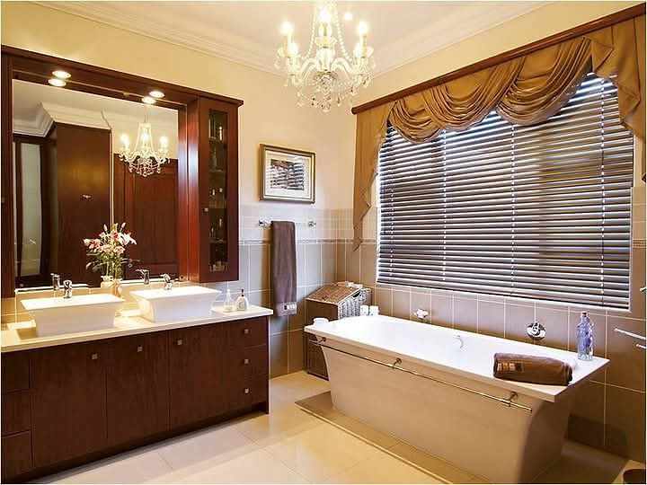 Elegant bathroom space with double vanity and bathtub