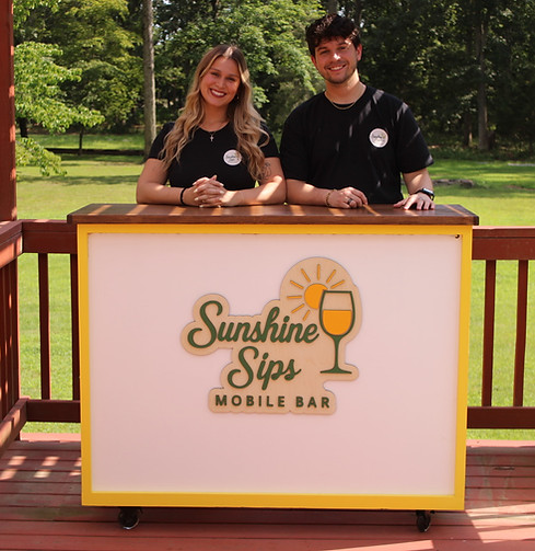 Meet the friendly faces behind Sunshine Sips Mobile Bar—your go-to bartending service for weddings, parties, and private events in South Jersey. Shown here ready to serve under sunny skies, our professional bartenders bring good vibes, handcrafted cocktails, and unforgettable service to every celebration.