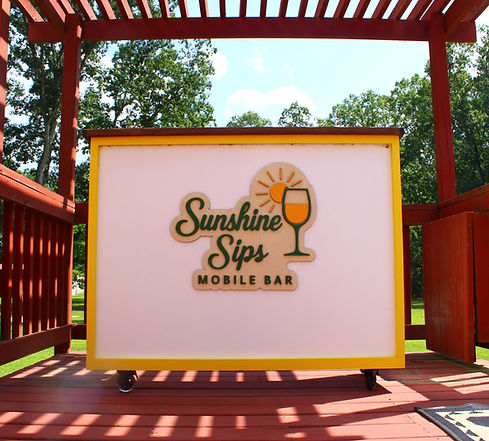 The Sunshine Sips Mobile Bar brings handcrafted cocktails and vibrant energy to events across South Jersey. Pictured here in a sleek, sunny setup under a red pergola, our mobile bar is perfect for weddings, private parties, corporate gatherings, and backyard celebrations—wherever the good vibes are flowing.