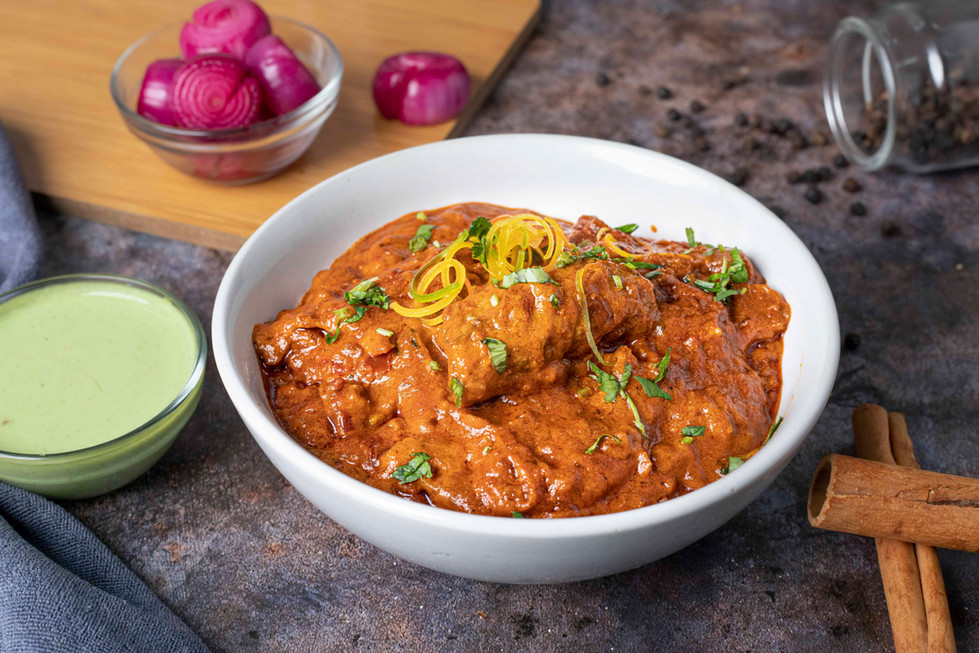 chicken tikka masala with rich spices and vibrant colors.