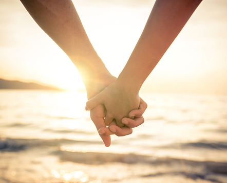 Holding hands on the beach
