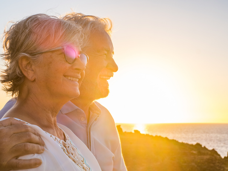 Over 60's couple looking out at the ocean