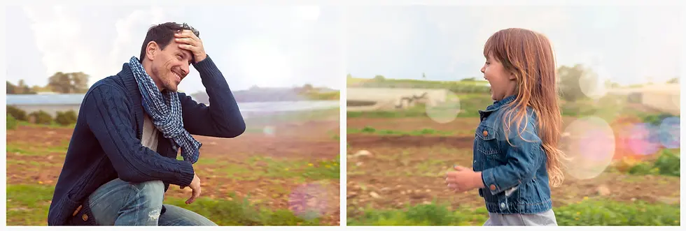 צילום פורטרט משפחתי רגוע בטבע המציג רגעי צחוק וקשר בין אב לבת על רקע נוף פתוח