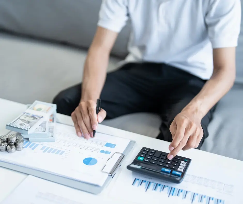 Sydney homeowner reviewing bills and repayments at home while considering debt consolidati