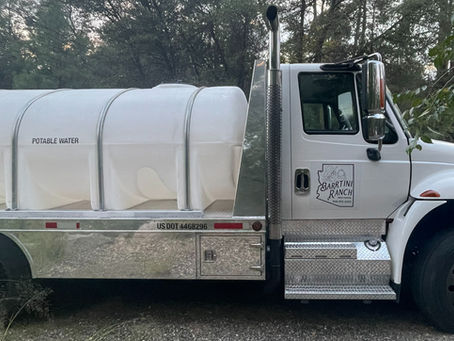 White Barrtini Ranch Water Hauling truck