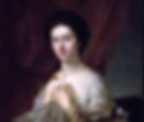 A formal 18th-century portrait of a young woman seated before a deep red curtain, painted by Nathaniel Hone in 1765. She gazes softly at the viewer, with dark hair pinned back and a delicate red necklace around her neck. She wears a sheer, embroidered gown and holds part of the fabric modestly to her chest. On the table beside her rests a sleepy black-and-white cat, adding a domestic and intimate touch to the elegant composition.